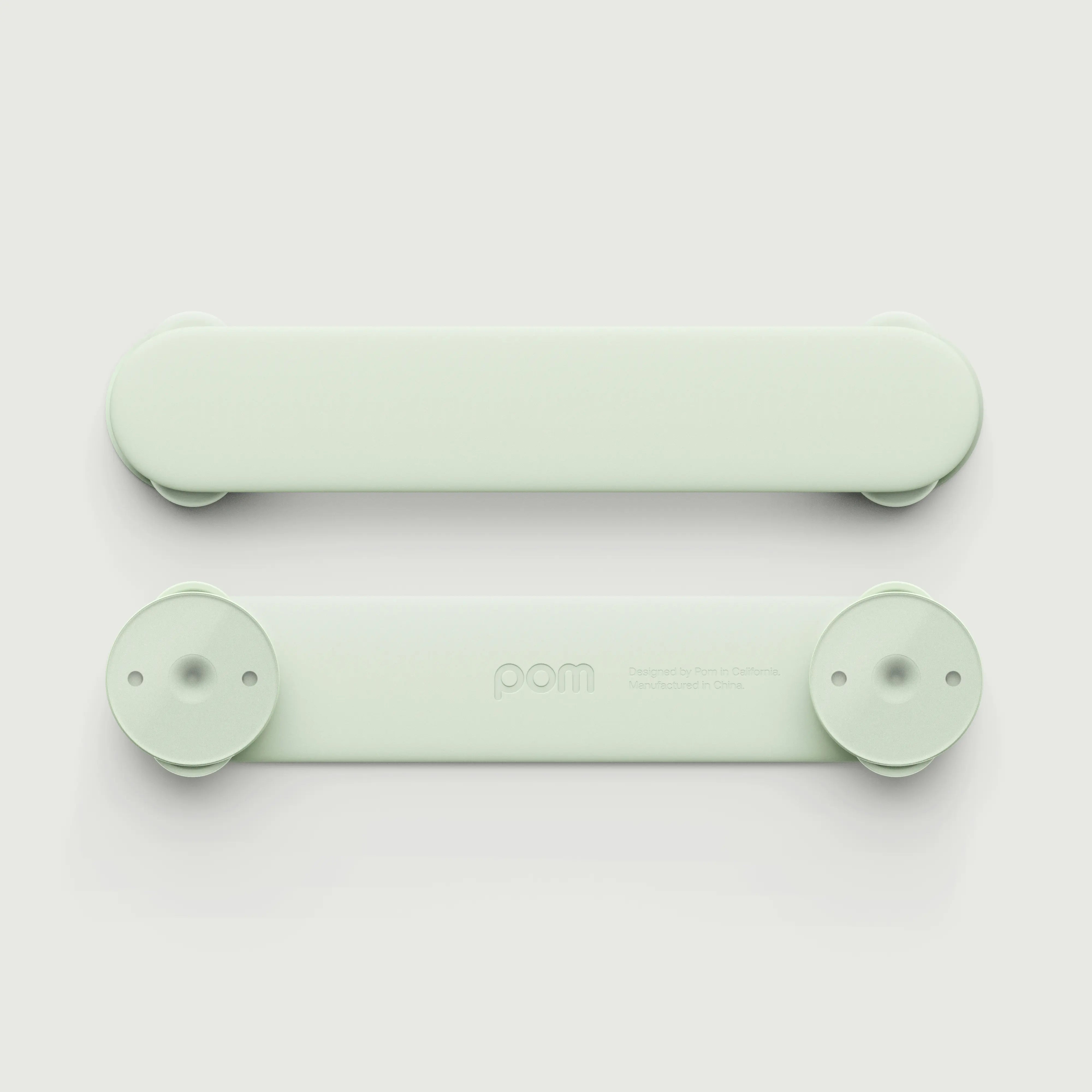 Pom Strap Lock — babyproof cabinets, drawers, and appliances with a modern, durable safety lock. Easy to install, secure, and designed for busy little ones.