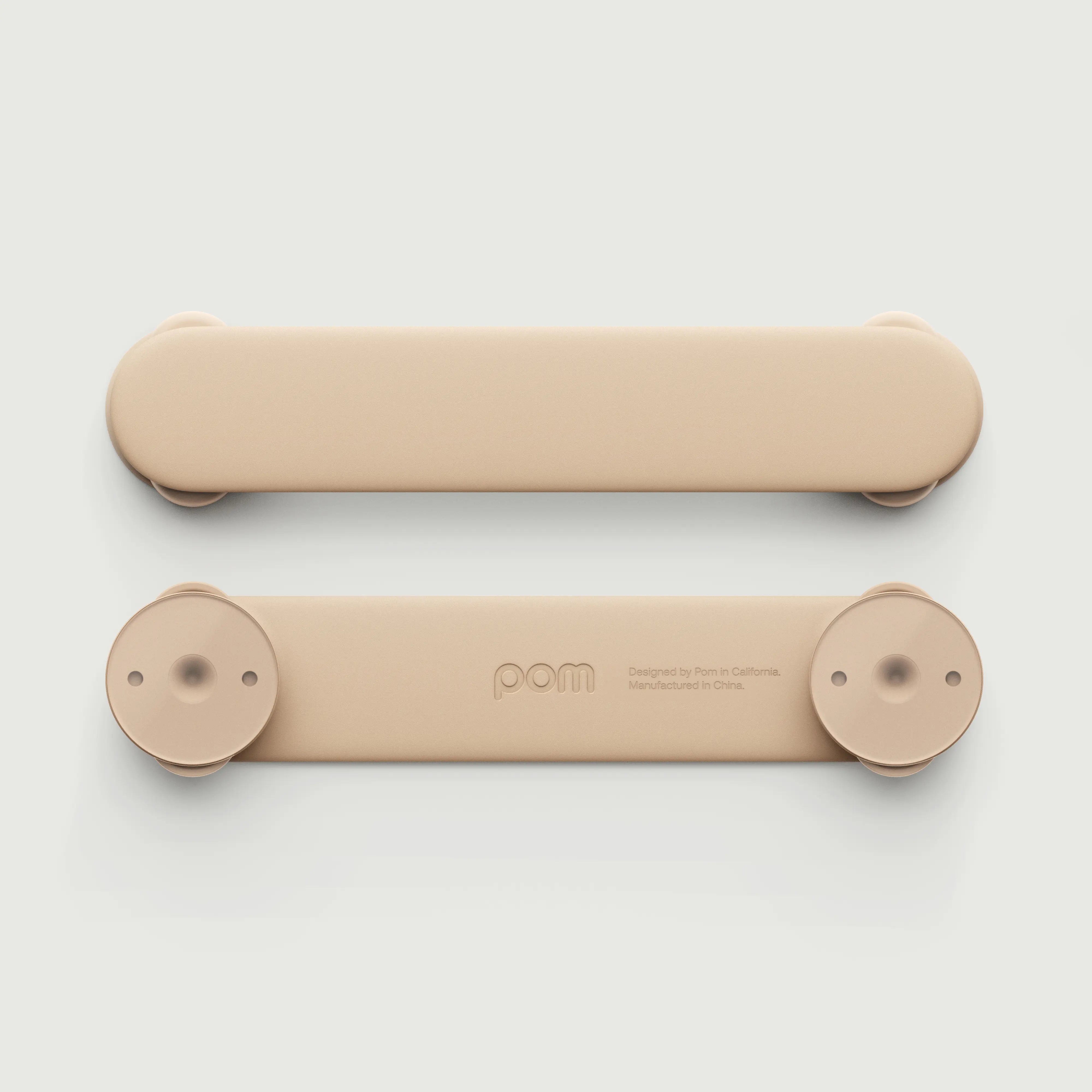 Pom Strap Lock — babyproof cabinets, drawers, and appliances with a modern, durable safety lock. Easy to install, secure, and designed for busy little ones.