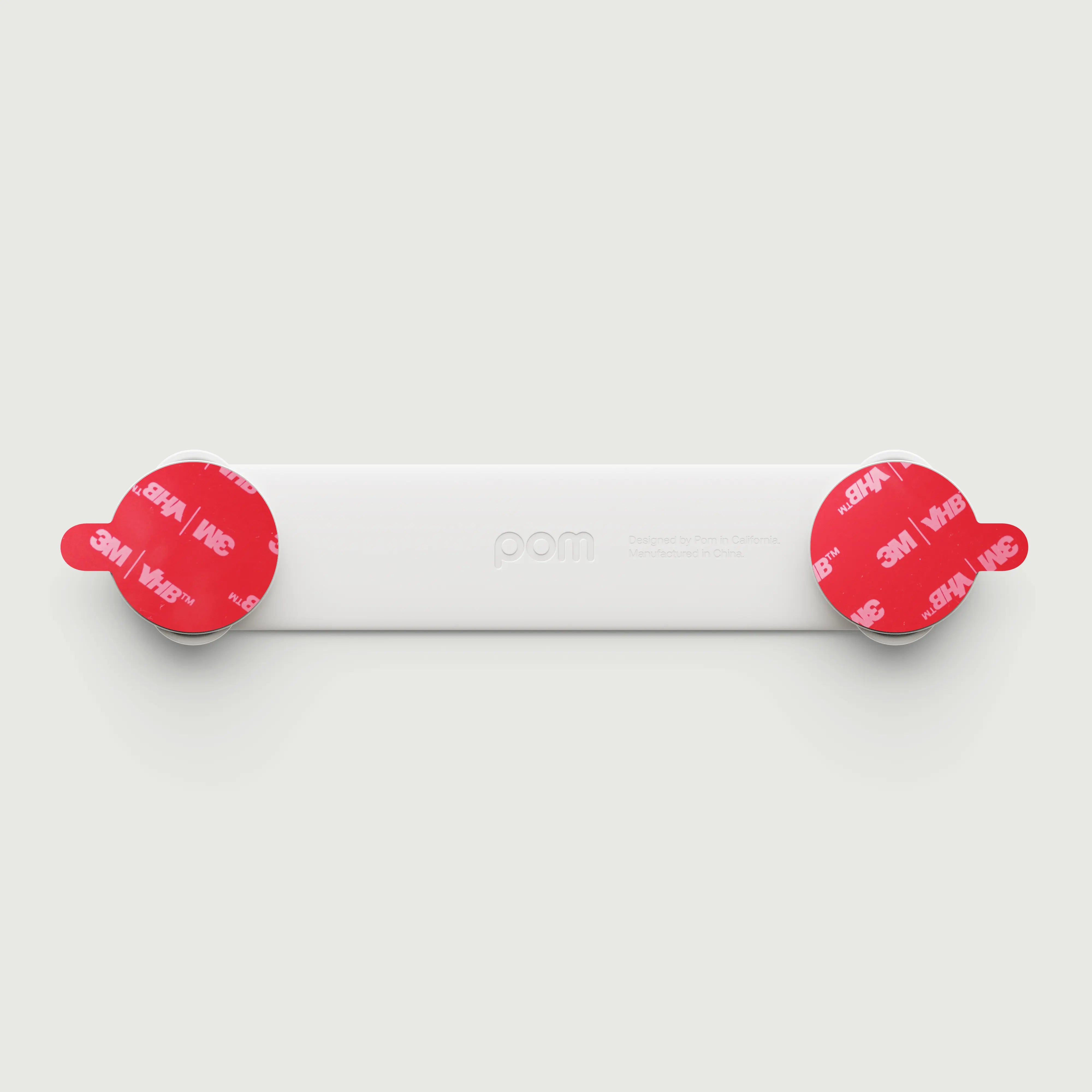 Pom Strap Lock — babyproof cabinets, drawers, and appliances with a modern, durable safety lock. Easy to install, secure, and designed for busy little ones.