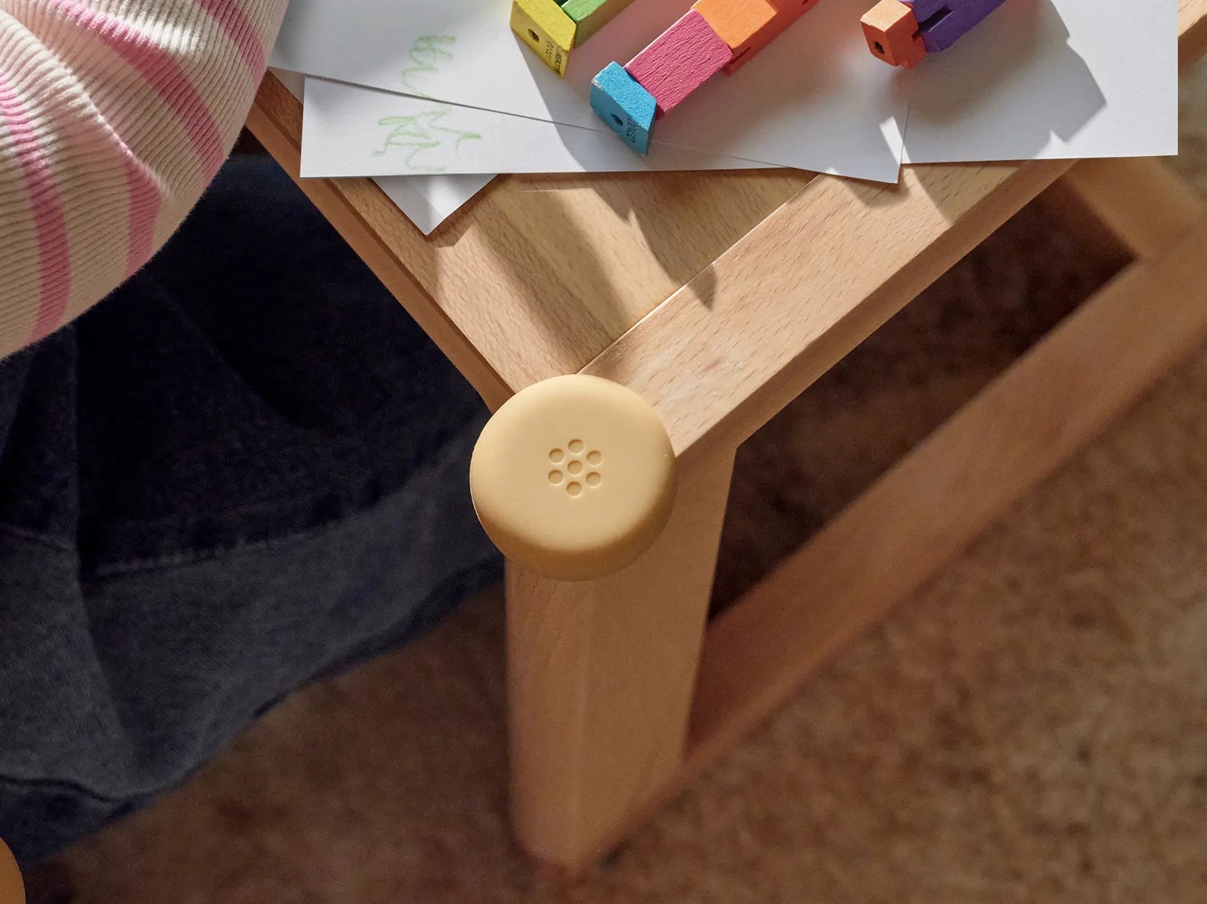 Pom Corner Protector — soft silicone babyproofing guard for sharp furniture corners in toddler room